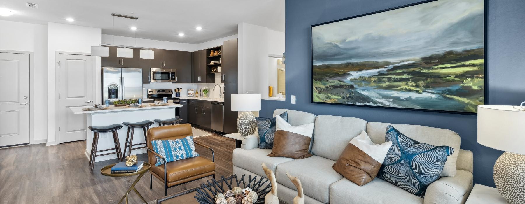 a living room with a large painting