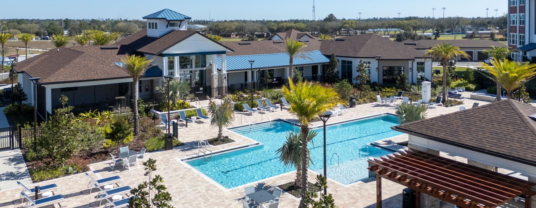 a pool surrounded by houses